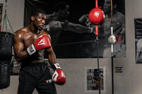 variant:7"::TITLE Boxing Double End Bag guy facing off with double end bag