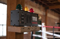 variant:lifestyle::TITLE Boxing Deluxe Gym Timer on a shelf at a boxing gym
