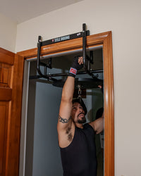 variant:lifestyle::TITLE Boxing Complete Doorway Speed Bag Platform being installed in a doorframe