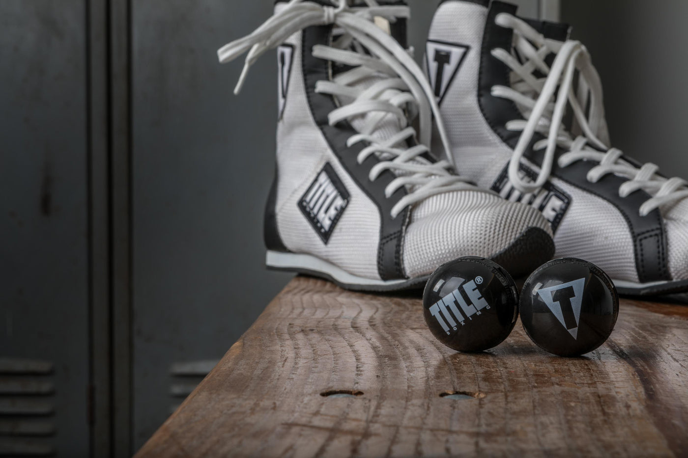 variant:lifestyle::TITLE Boxing Equipment Deodorizer Balls in front of a pair of boxing shoes