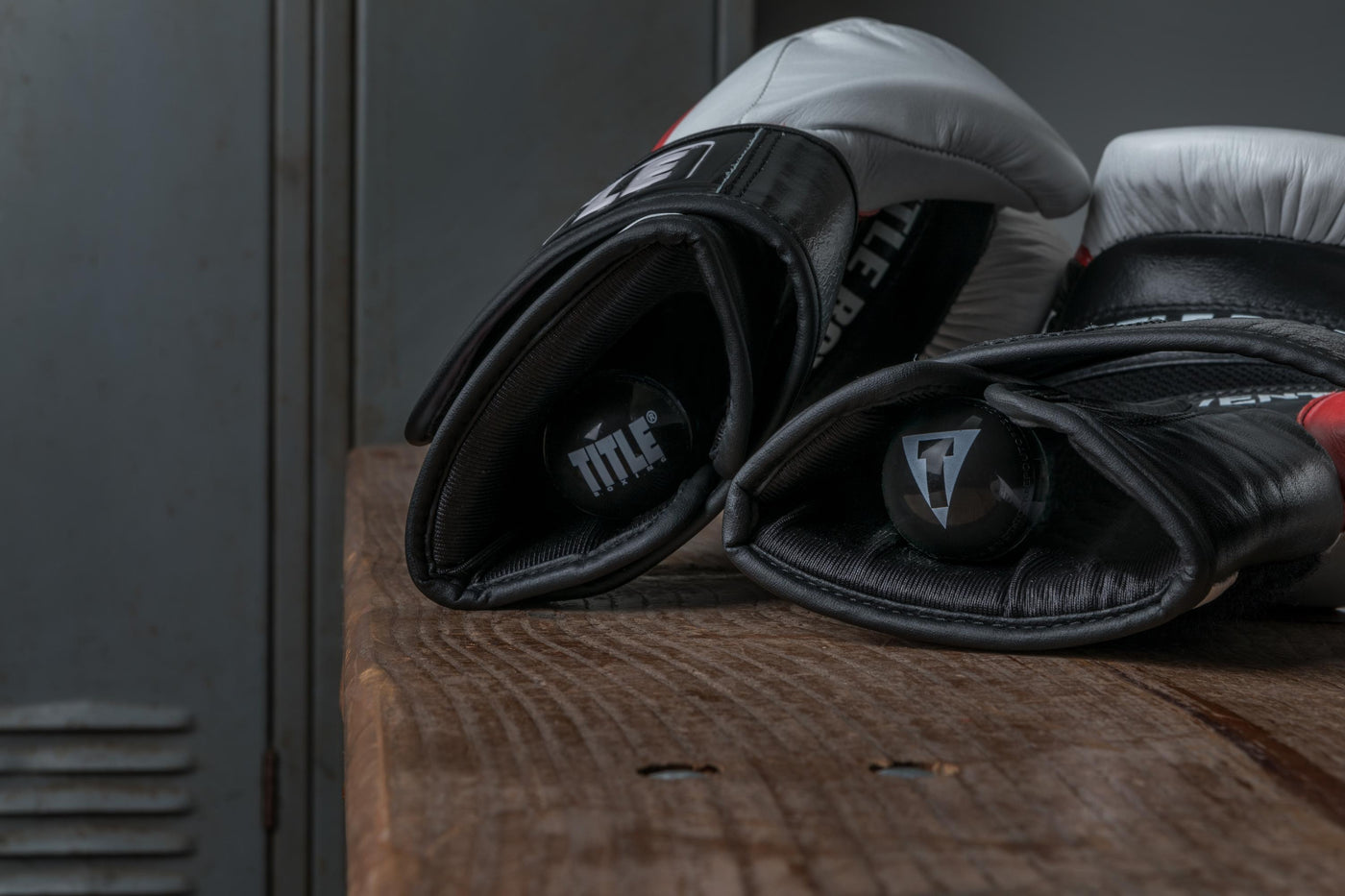 variant:lifestyle::TITLE Boxing Equipment Deodorizer Balls in use in a pair of boxing gloves