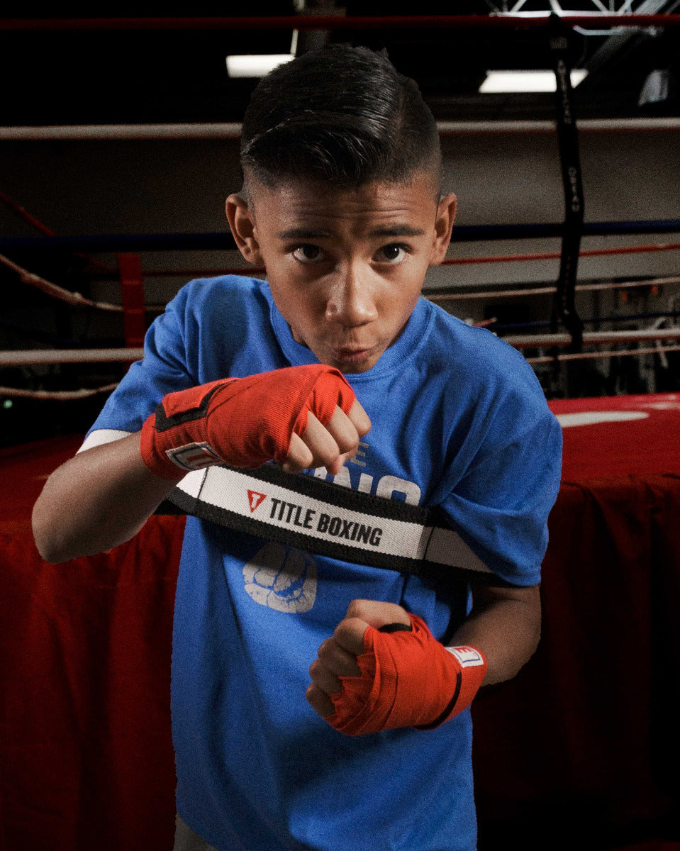 variant:Y::TITLE Boxing Elbows In Trainer youth size being used by child boxer