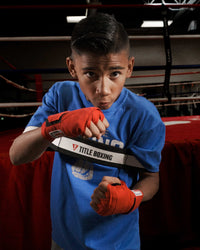 variant:Y::TITLE Boxing Elbows In Trainer youth size being used by child boxer