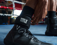 variant:lifestyle::TITLE Boxing Fast Feet 2.0 close up of the angle strap on a boxer