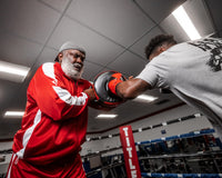 variant:black/red::TITLE Boxing Fighting Fresh Punch Shield guy punching punch shield while coach is holding