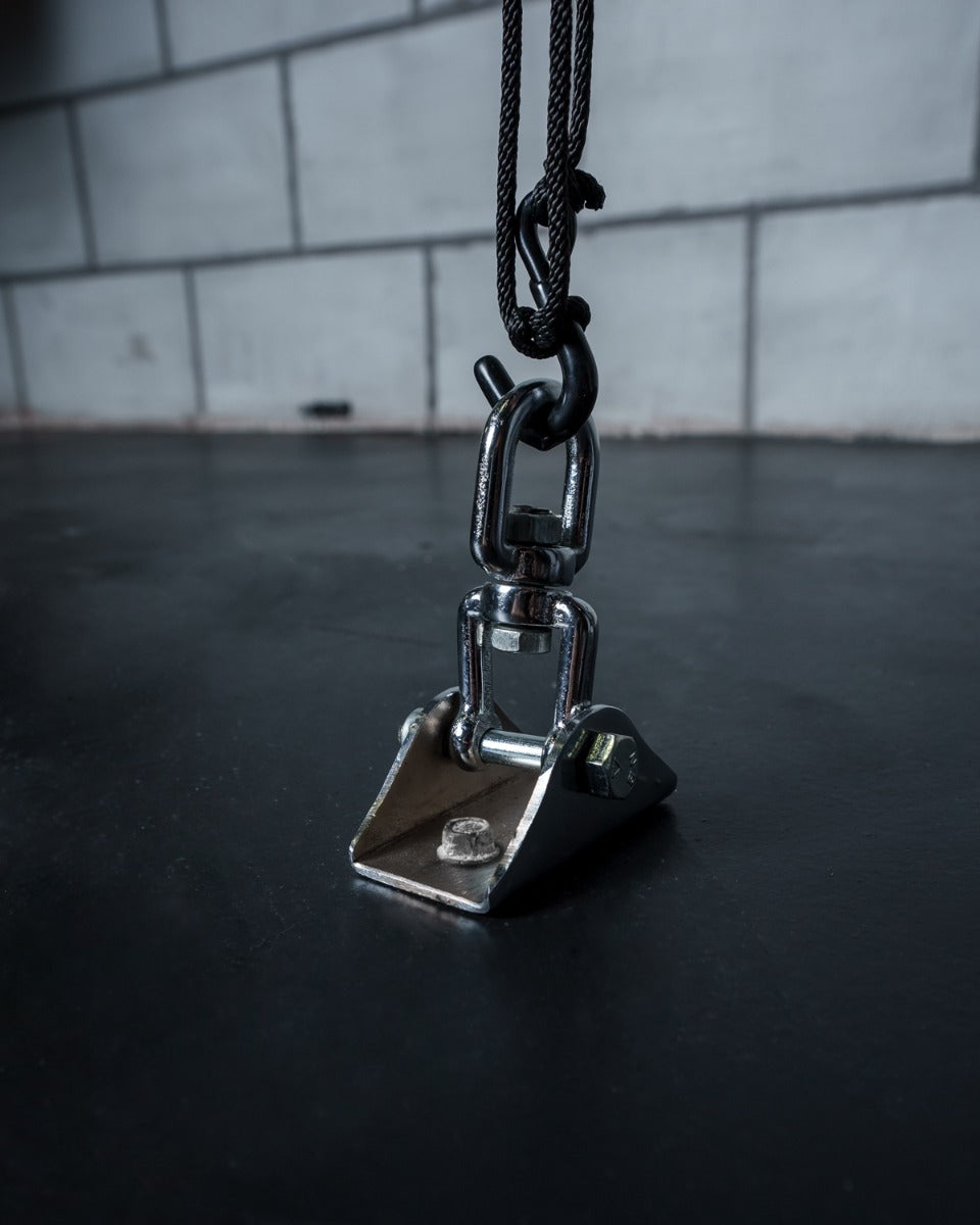 variant:lifestyle::TITLE Boxing Floor Mount Bag Anchor in use on the floor of a boxing gym