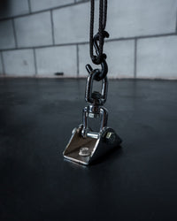 variant:lifestyle::TITLE Boxing Floor Mount Bag Anchor in use on the floor of a boxing gym