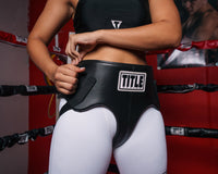 variant:lifestyle::TITLE Boxing Female No-Foul Protector 2.0 woman wearing no fould protector