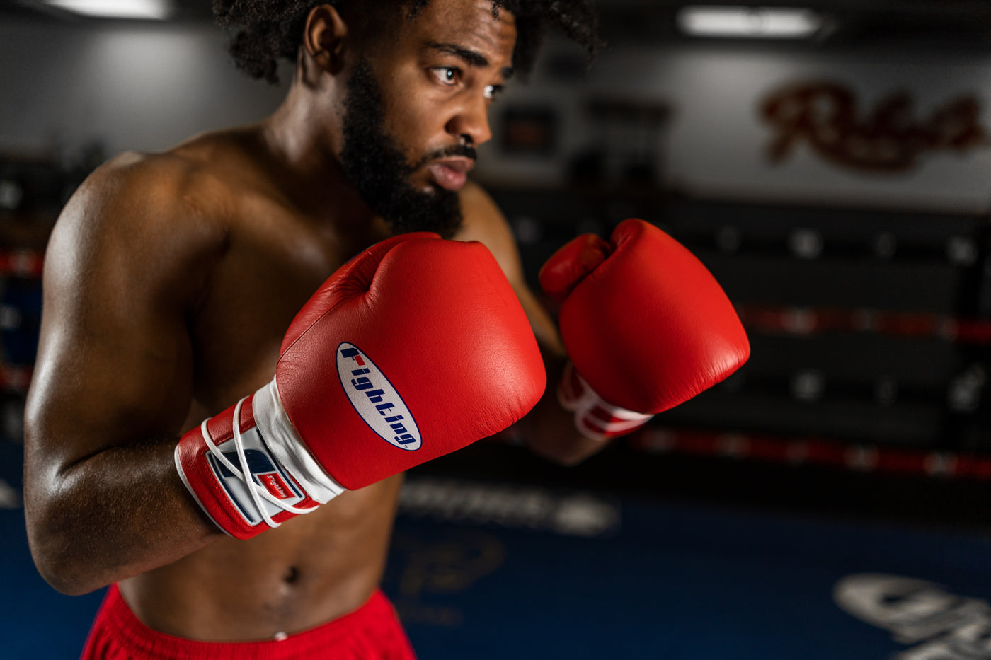 variant:red::Fighting Fury Professional Lace Training Gloves guy posing with boxing gloves