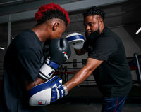 variant:lifestyle::Fighting Force Leather Punch Mitts coach and kid mitting