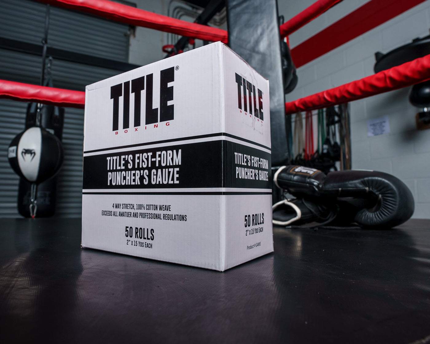 variant:lifestyle::TITLE Boxing Fist-Form Puncher’s Gauze on a boxing ring floor