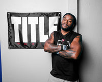 variant:lifestyle::TITLE Boxing Big Logo Banner on the wall of a boxing gym