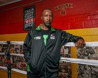 variant:lifestyle::TITLE Boxing Train Fight Win Repeat Banner on KRONK boxing gym wall