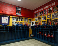 variant:lifestyle::TITLE Boxing Pro Fight Banner hanging on the wall of KRONK boxing gym