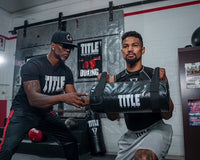 variant:lifestyle::TITLE Boxing Pro Fight Banner hanging in a boxing gym