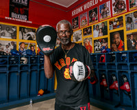 variant:lifestyle::TITLE Boxing Gel World Contoured Punch Mitts coach with kronk tee on
