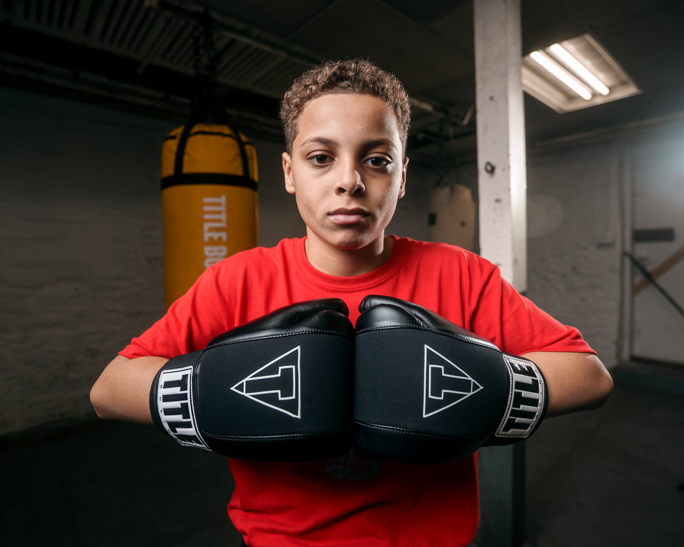 variant:black::TITLE Boxing Gel Washable Fitness Gloves 3.0 kid with hands together