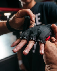 variant:lifestyle::TITLE Boxing Gel Iron Fist Slip-On Knuckle Shields 2.0 close up of shields