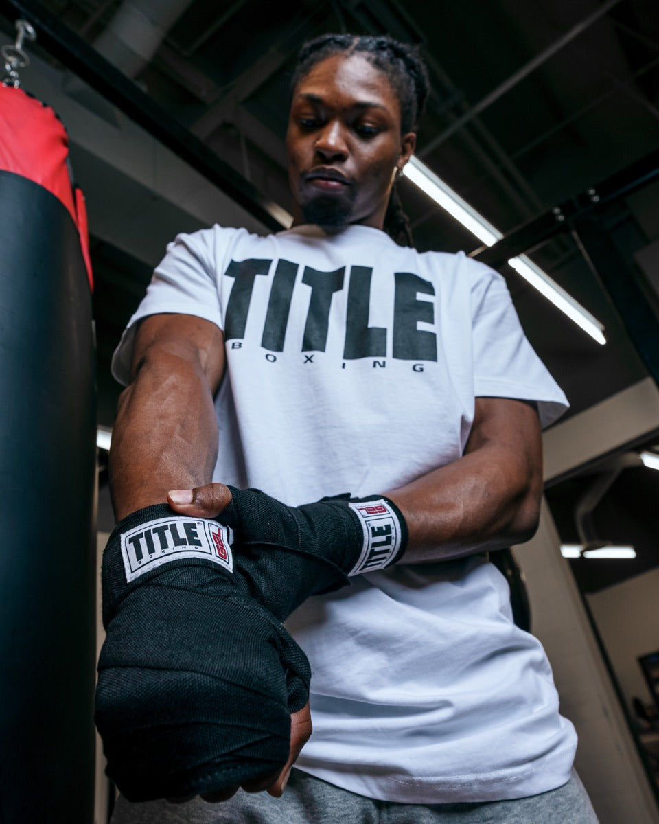 variant:lifestyle::TITLE Boxing Gel Iron Fist Wraps close up of wraps on hands