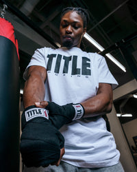 variant:lifestyle::TITLE Boxing Gel Iron Fist Wraps close up of wraps on hands
