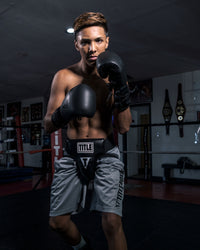 variant:lifestyle::TITLE Boxing Groin Protector Plus 2.0 man posing with groin protector