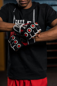 variant:lifestyle::TITLE Boxing Gel Rage Fist Wrap Gloves close up on gloves