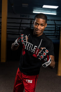 variant:lifestyle::TITLE Boxing Gel Rage Fist Wrap Gloves man posing with gloves