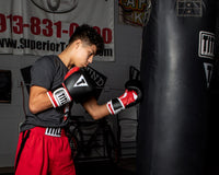 variant:black/red::TITLE Boxing Gel World 2.0 Bag Gloves kid hitting bag