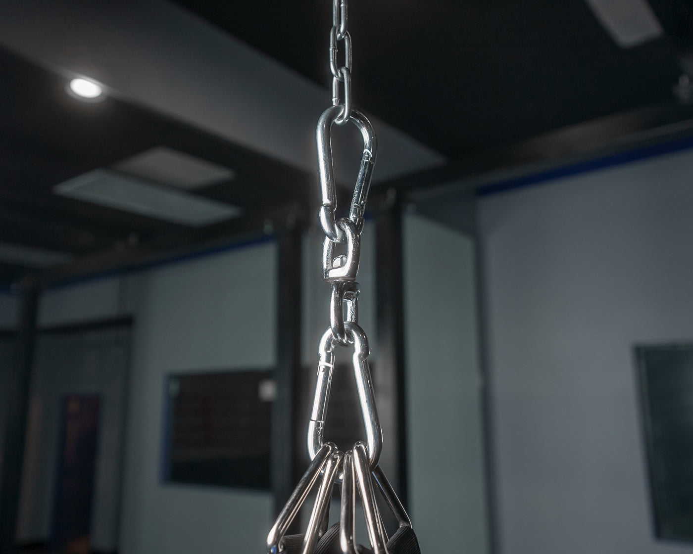 variant:lifestyle::TITLE Boxing Heavy Bag Swivel Assembly in use in a boxing gym