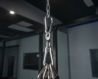 variant:lifestyle::TITLE Boxing Heavy Bag Swivel Assembly in use in a boxing gym