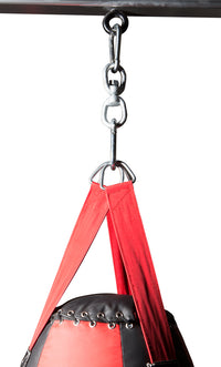 variant:lifestyle::TITLE Boxing Heavy Bag Swivel Assembly up close with a heavy bag