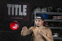 variant:lifestyle::TITLE Boxing Reflex Ball in use in a boxing gym