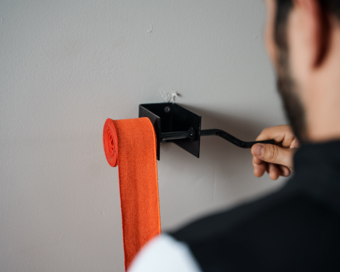 variant:lifestyle::TITLE Boxing Metal Hand Wrap Roller in use 