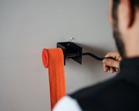 variant:lifestyle::TITLE Boxing Metal Hand Wrap Roller in use 