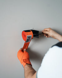 variant:lifestyle::TITLE Boxing Metal Hand Wrap Roller in use