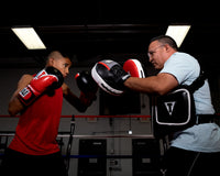 variant:red/black::TITLE Boxing Infused Foam Interrogate Training Gloves 2.0 guy and coach boxing with boxing gloves and punching mitts