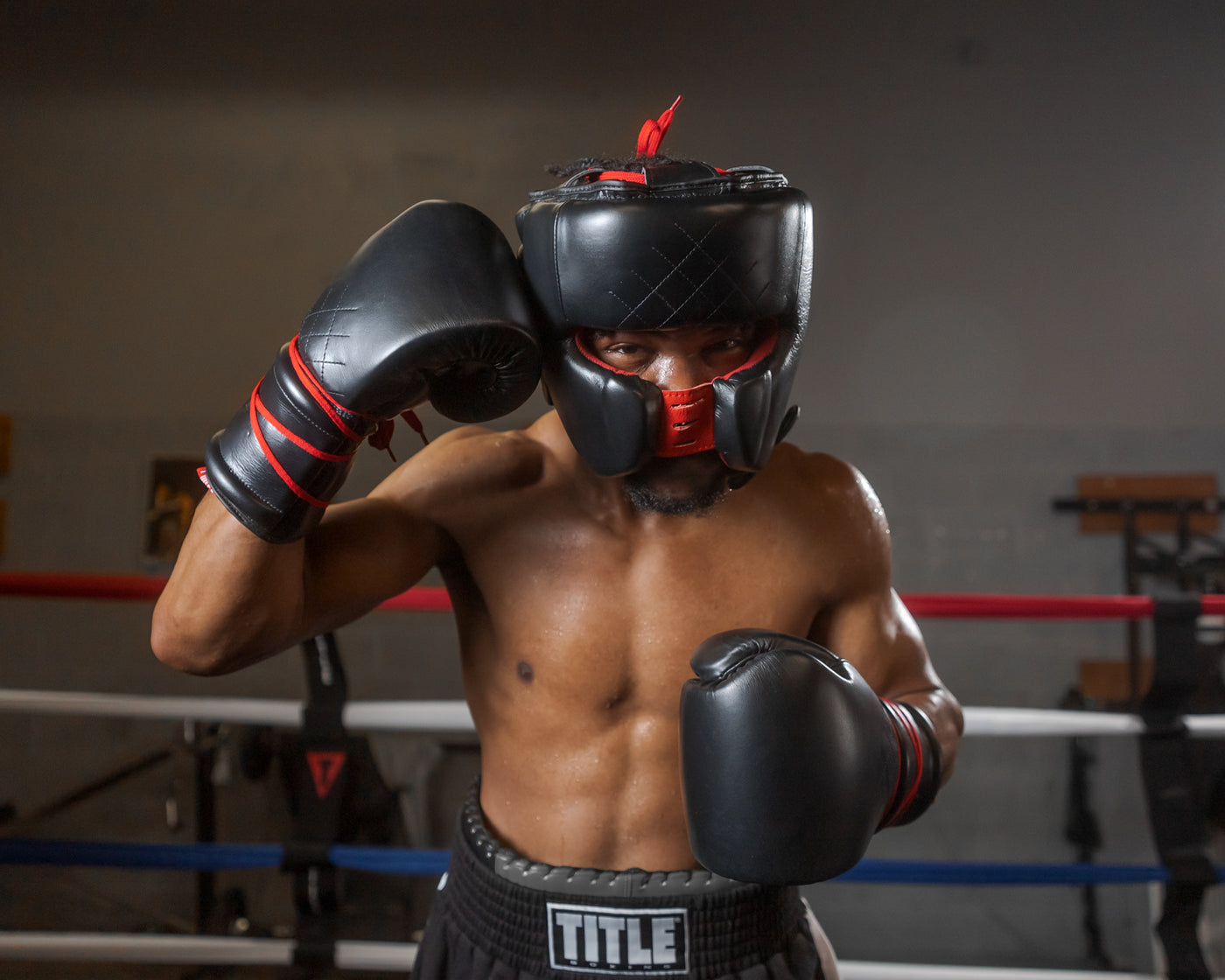 variant:Black::TITLE Boxing Ko-Vert Headgear  man posing in headgear