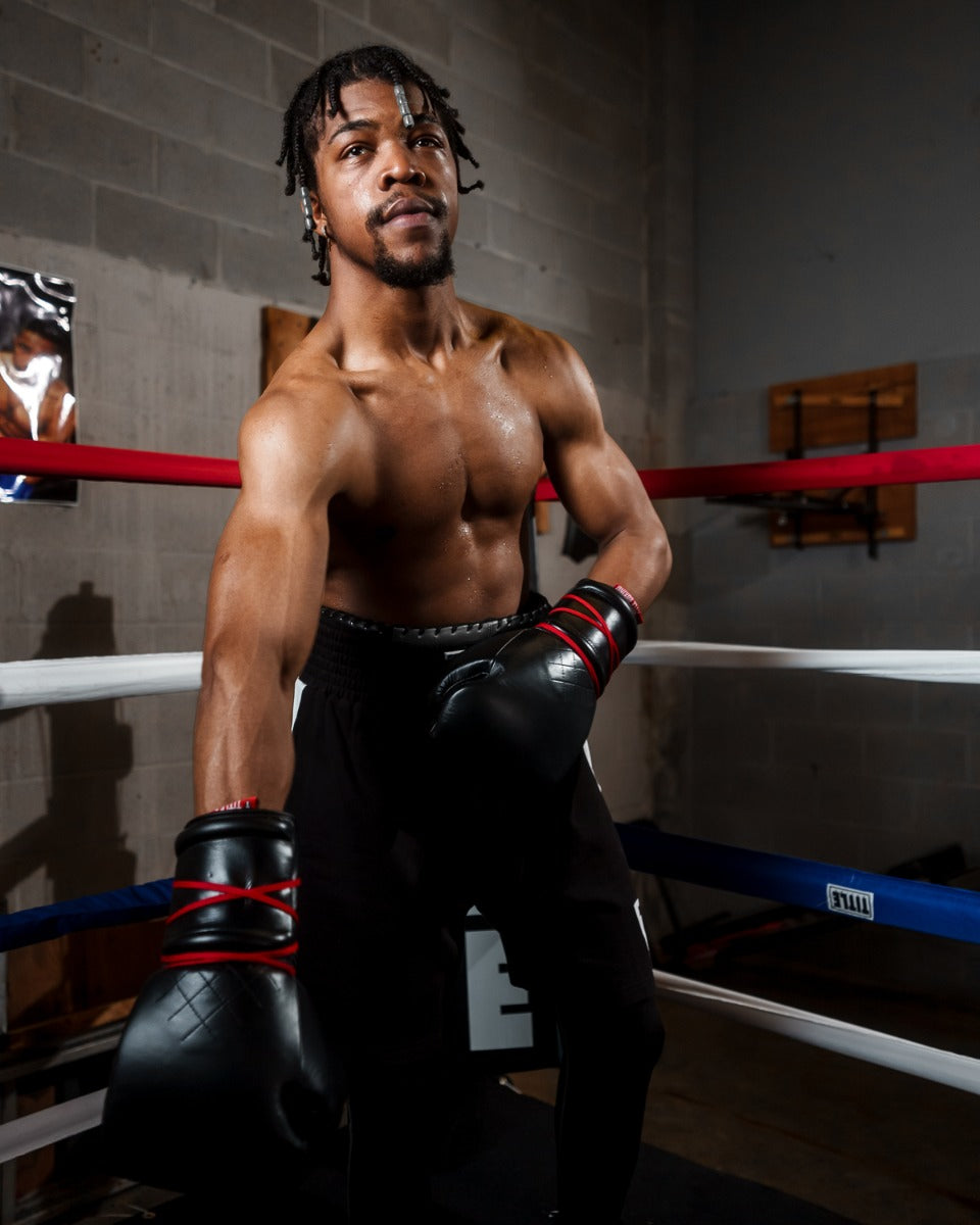 variant:Black::TITLE Boxing Ko-Vert Sparring Gloves man wearing gloves