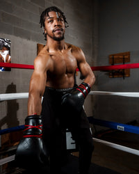 variant:Black::TITLE Boxing Ko-Vert Sparring Gloves man wearing gloves