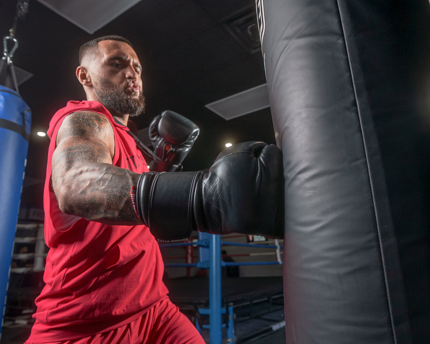 variant:Black::TITLE Boxing Ko-Vert Training Gloves man punching bag