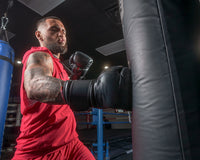 variant:Black::TITLE Boxing Ko-Vert Training Gloves man punching bag