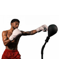 variant:lifestyle::TITLE Boxing Lightning Strike Pro Reflex Bag with Anchor being used by a boxer