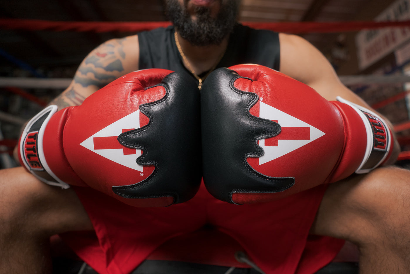 variant:Red/Black/White::TITLE Boxing Gel Lava Leather Series Training Gloves close up of hands together