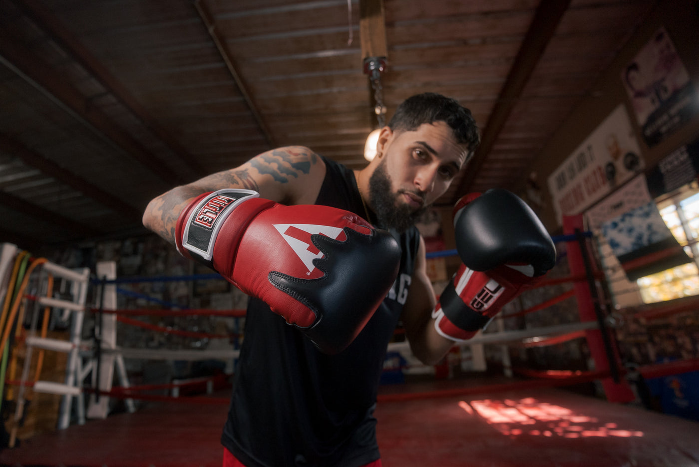 variant:Red/Black/White::TITLE Boxing Gel Lava Leather Series Training Gloves boxing pose