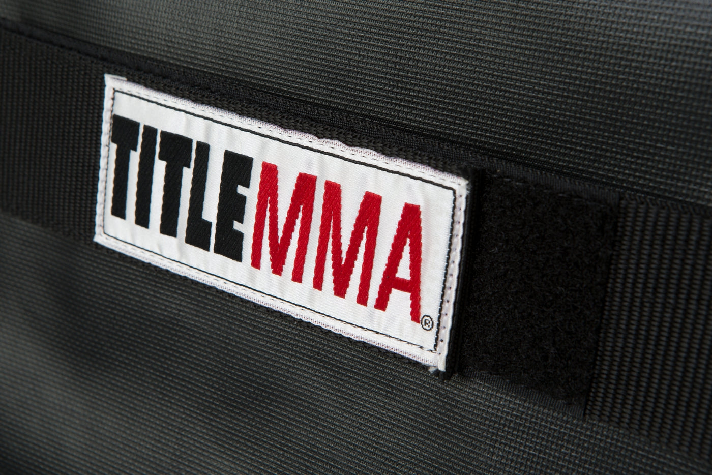 variant:lifestyle::TITLE MMA Blank Cage Bumper Pad close up view 