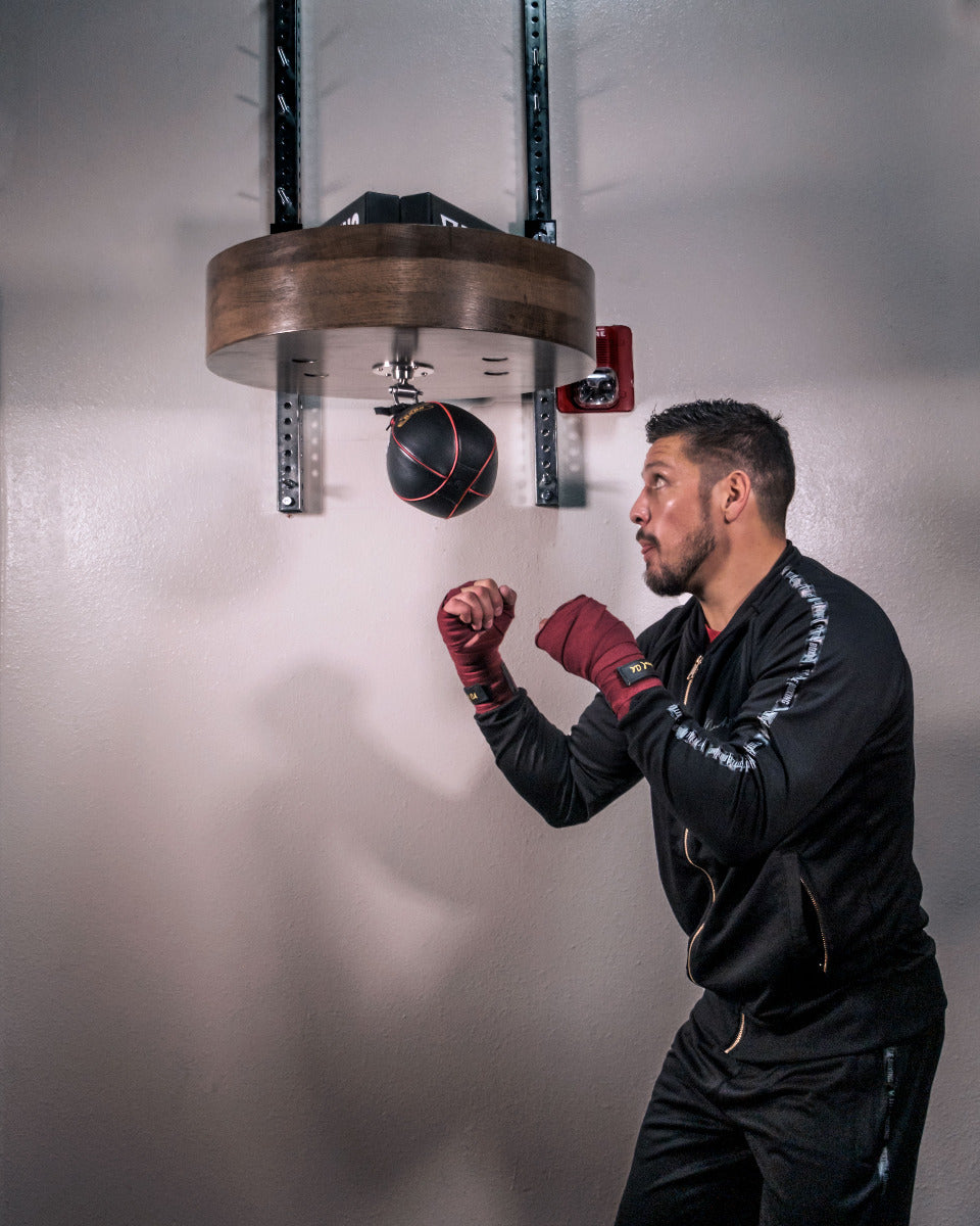 variant:lifestyle::TITLE Boxing Oversized Professional Speed Bag Platform man boxing on speed bag