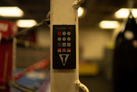 variant:lifestyle::TITLE Platinum Replacement Remote For PFGT in a boxing gym