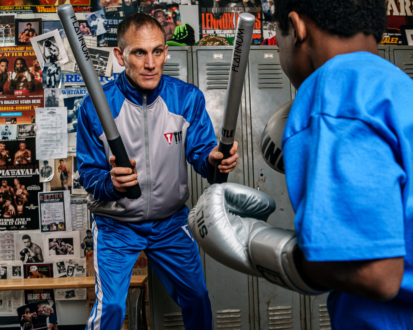 variant:lifestyle::TITLE Platinum Striking Sticks coach and kid
