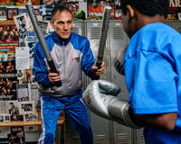 variant:lifestyle::TITLE Platinum Striking Sticks coach and kid