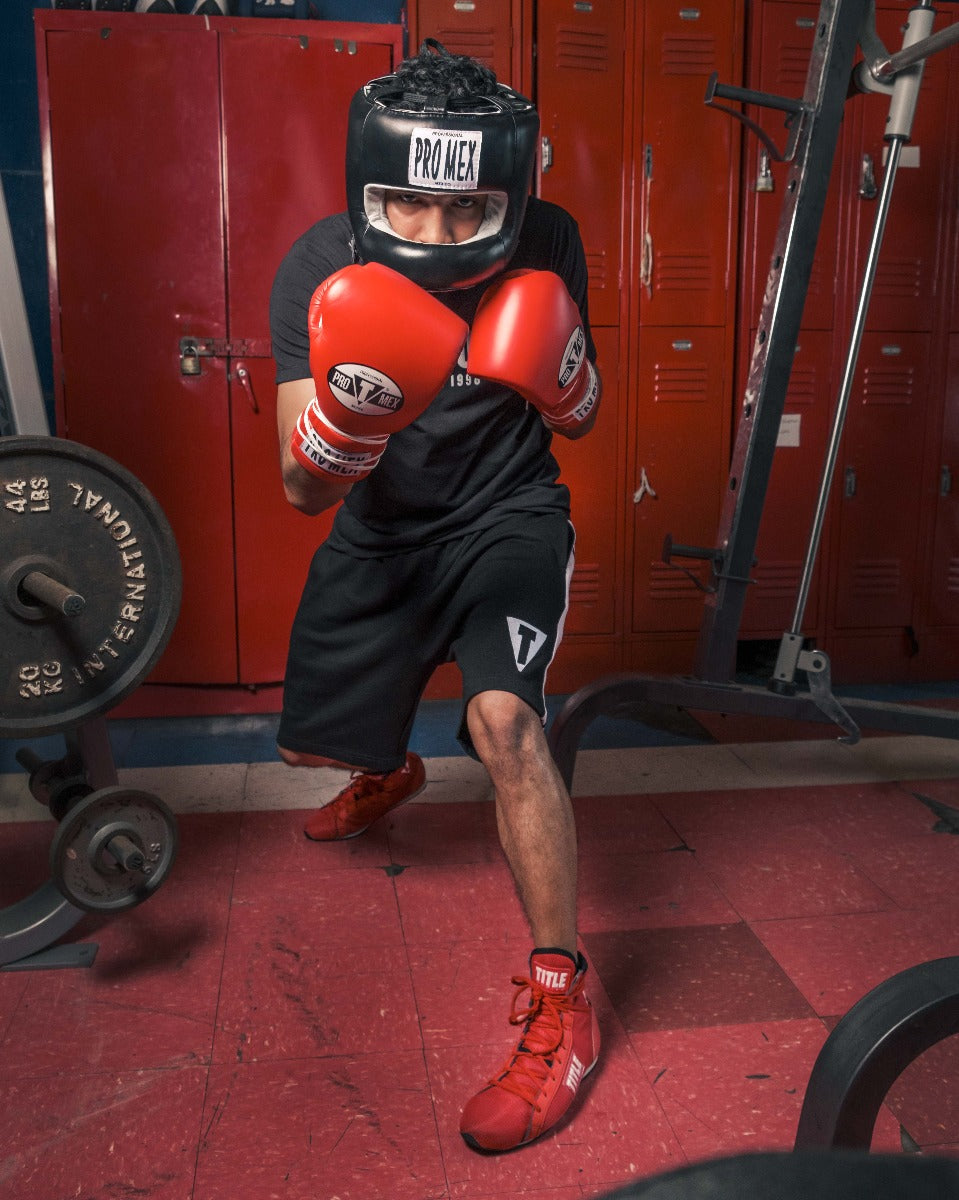 variant:Black::Pro Mex Pro Facesaver Headgear 3 boy wearing headgear